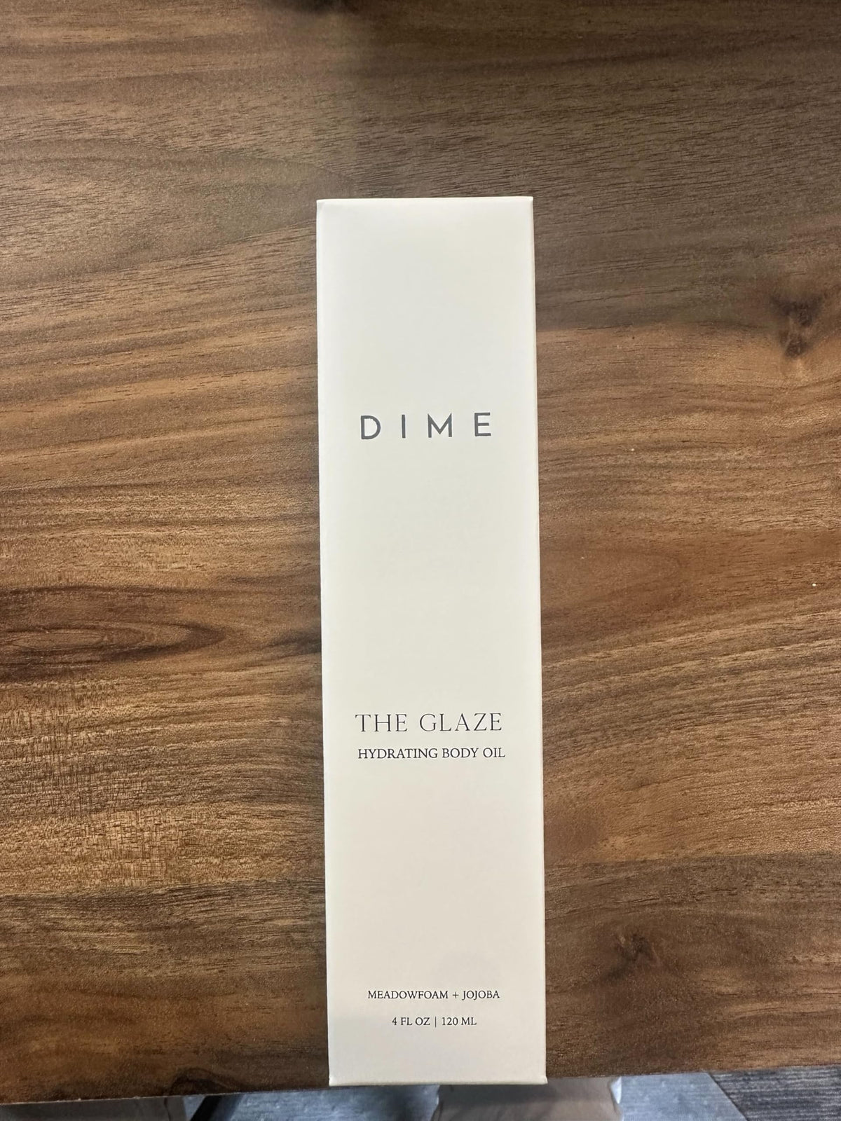 DIME Glaze Body Oil blend close-up highlights argan and rosehip among nourishing oils.