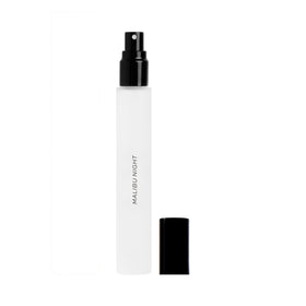 DIME Malibu Night bottle bathed in sunset glow, ideal for evening wear.