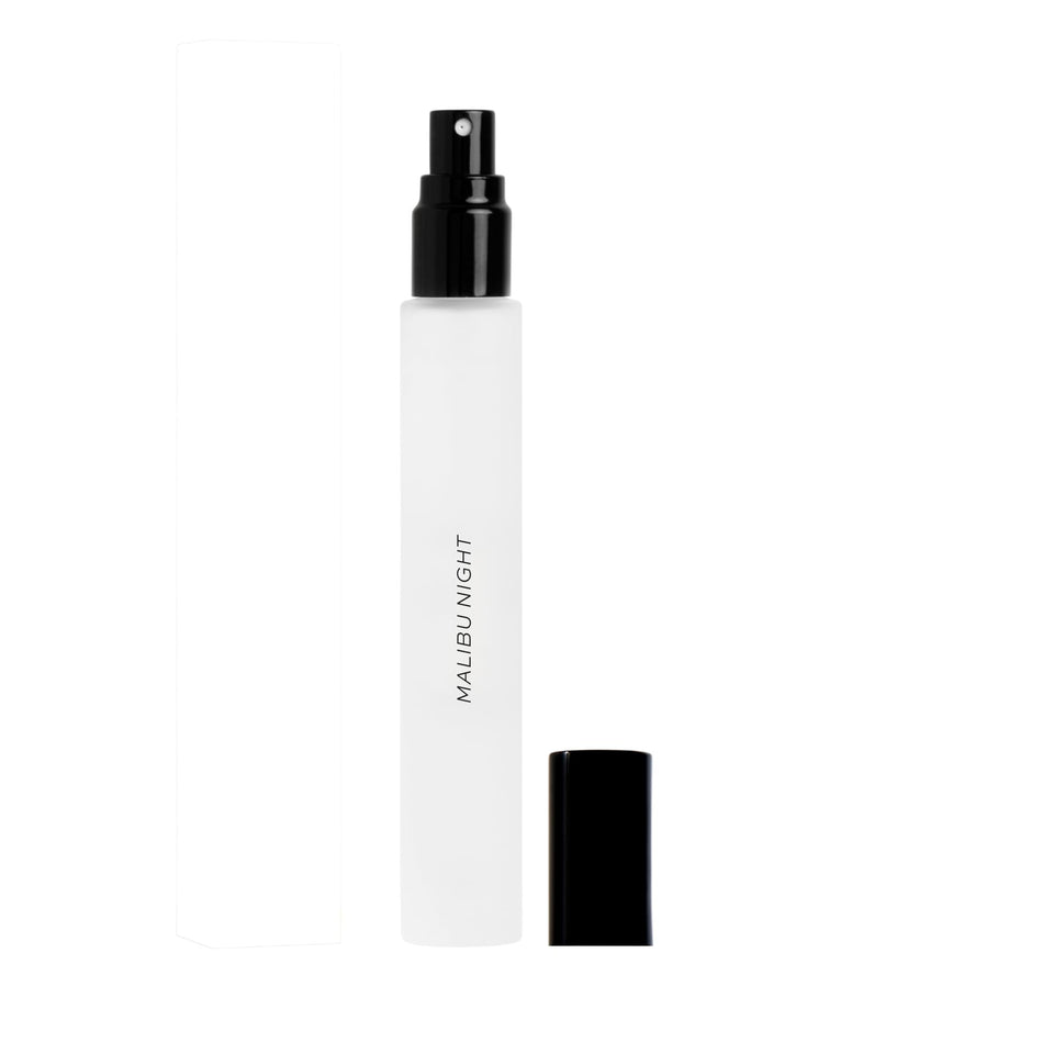 DIME Malibu Night bottle bathed in sunset glow, ideal for evening wear.