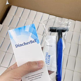 DincherBel shaving cream 12g paired with razors for ready-to-use grooming.