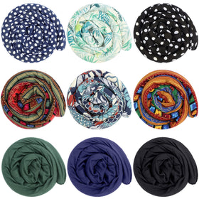 Dingion dreadlock tie with dot pattern secures a thick ponytail.