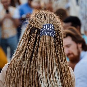 Dingion dreadlock tie wrapped in hair shows durable hold for thick curls.
