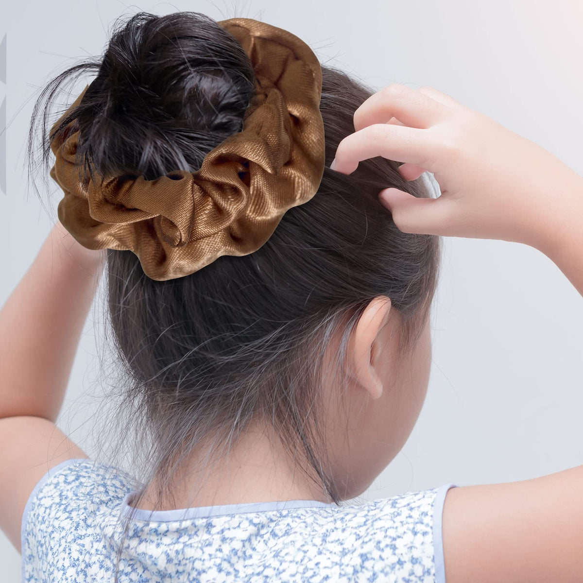 Dingion satin scrunchies worn in ponytails for quick, easy hairstyles