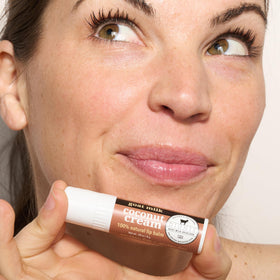 Dionis coconut cream lip balm application demonstrates smooth, non-greasy hydration.