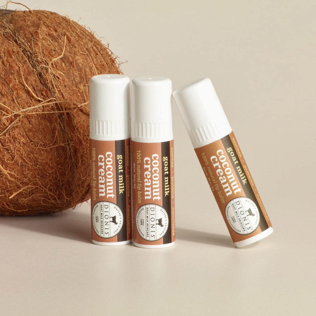 Dionis goat milk lip balm close-up reveals creamy texture and glide.