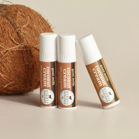 Dionis goat milk lip balm close-up reveals creamy texture and glide.