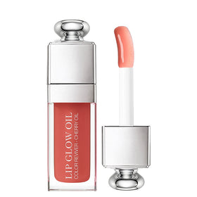 Dior Addict Lip Glow Oil 012 Rosewood bottle close-up showing the sleek packaging and gloss-ready shine