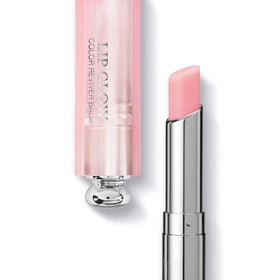 Close-up of Dior Addict Lip Glow tube conveying sheer, moisturizing lip balm experience.