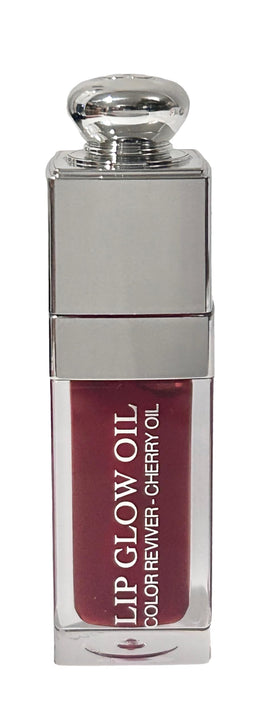 Dior Lip Glow Oil Color Reviver 062 cherry oil swatch on lips showing natural rosy tint and shine.