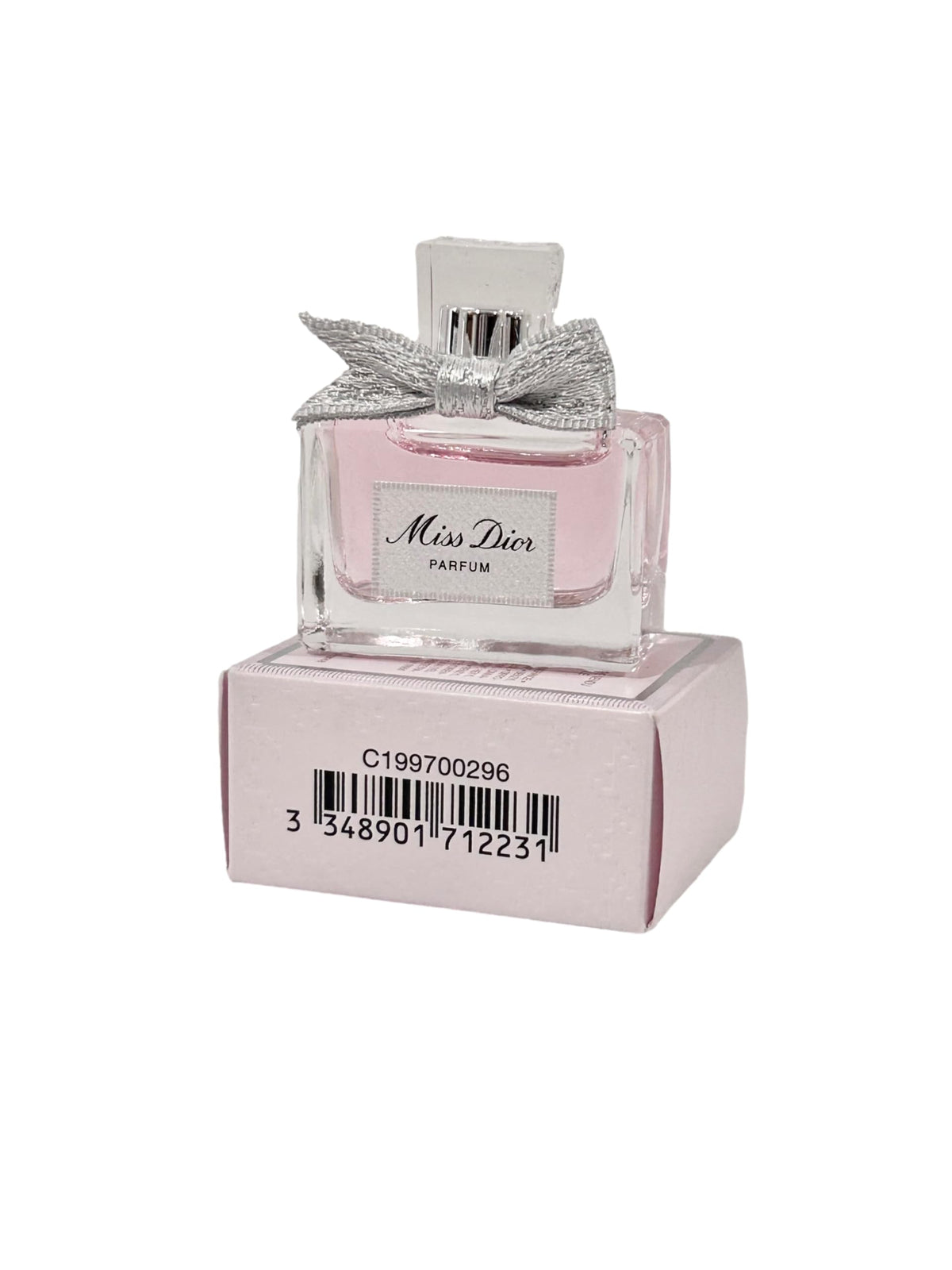 Dior Mini Parfum dabber in action for quick scent touch-ups.