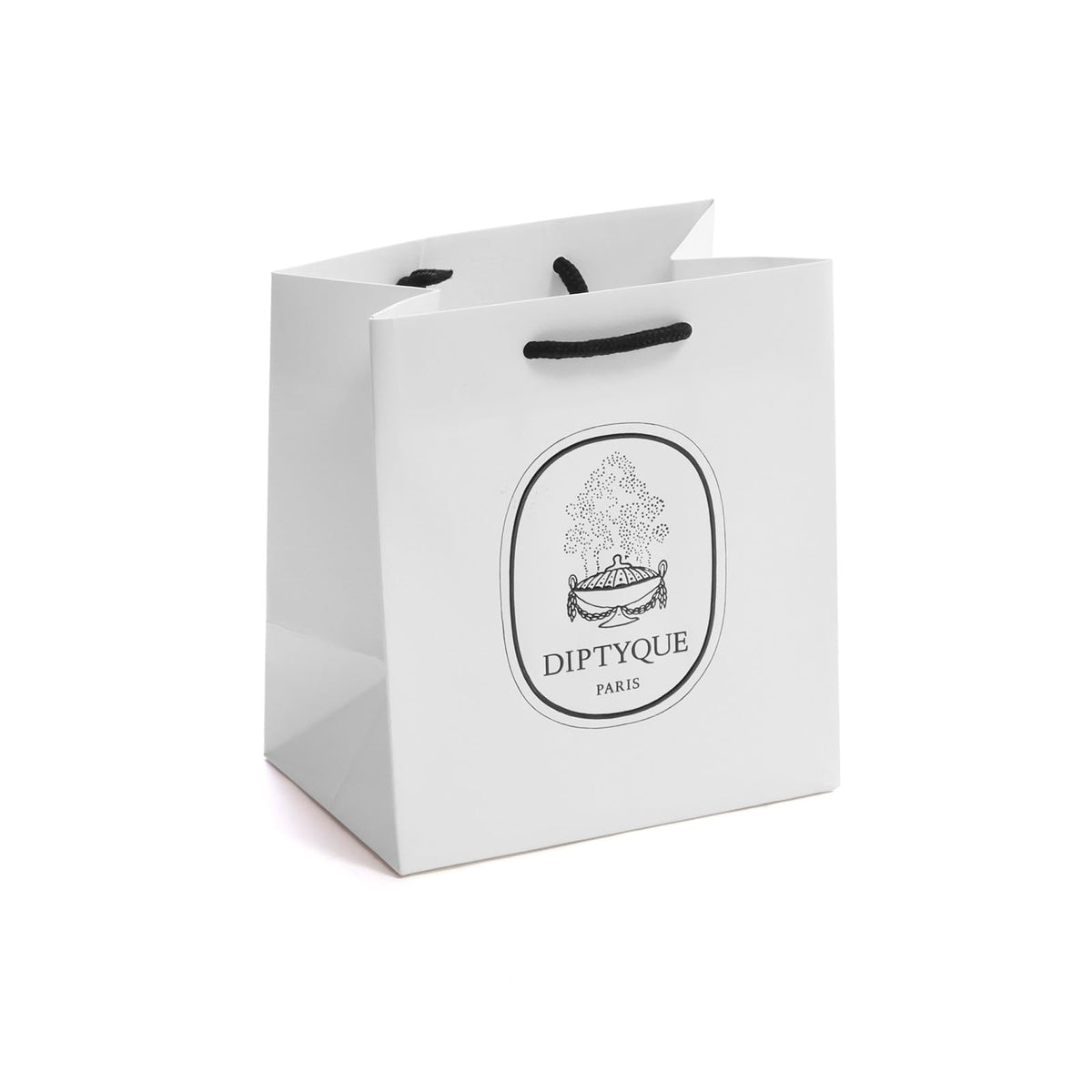 Diptyque Orpheon on a softly lit surface evokes warm comforting aura.