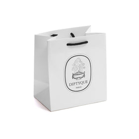 Diptyque Orpheon on a softly lit surface evokes warm comforting aura.