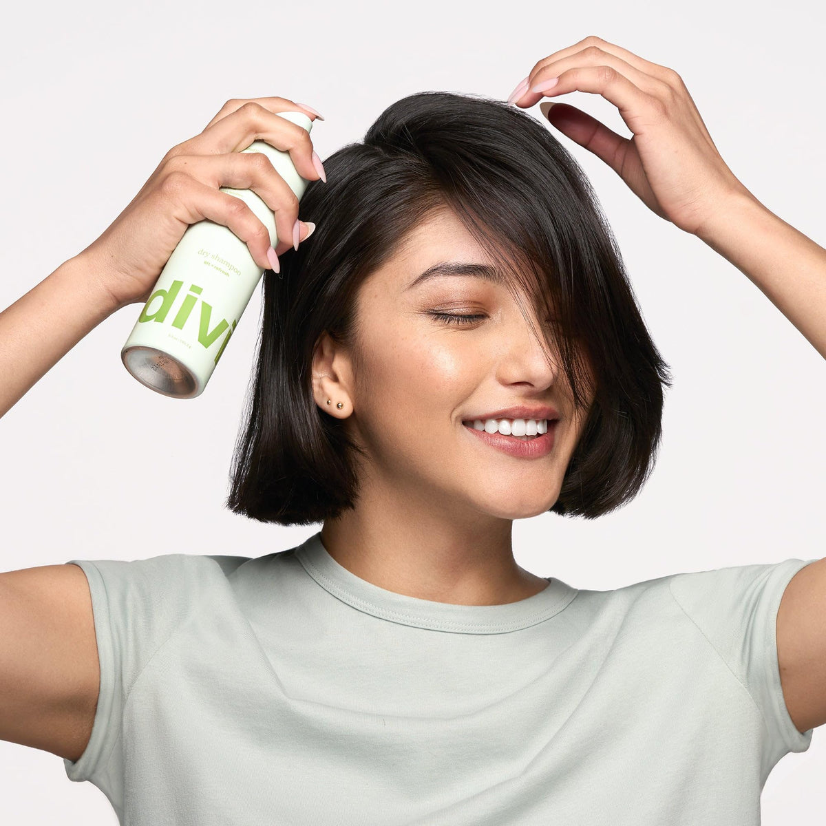 Divi Dry Shampoo travel-size bottle for on-the-go refresh and volume.