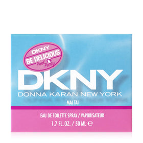 Sunlit DKNY Be Delicious Pool Party Mai Tai bottle on a vanity, playful NYC energy