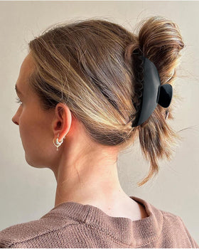 DMJHJY hair clip shown in a French twist for secure updos.