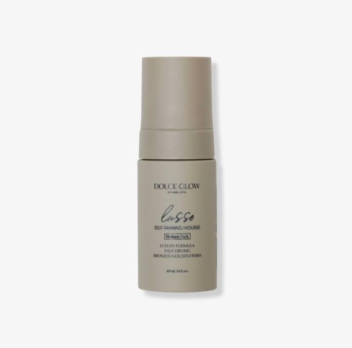 Dolce Glow Lusso Mousse Travel Size bottle showing a buildable bronze glow