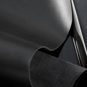 Dolce&Gabbana K Intense travel spray close-up highlighting leathery woody notes