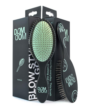 Dom Dom detangling brush with drainage hole for quick drying after shower