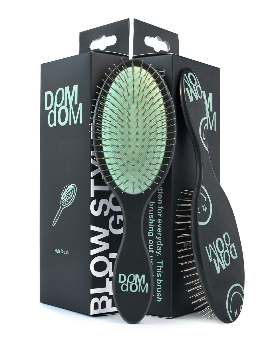 Dom Dom detangling brush with drainage hole for quick drying after shower