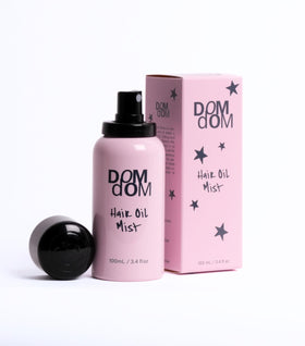 Dom Dom Hair Oil Mist spray shows even application for smooth, frizz-free results