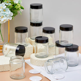 White Domensi jars displayed for travel-friendly storage in a compact pack.