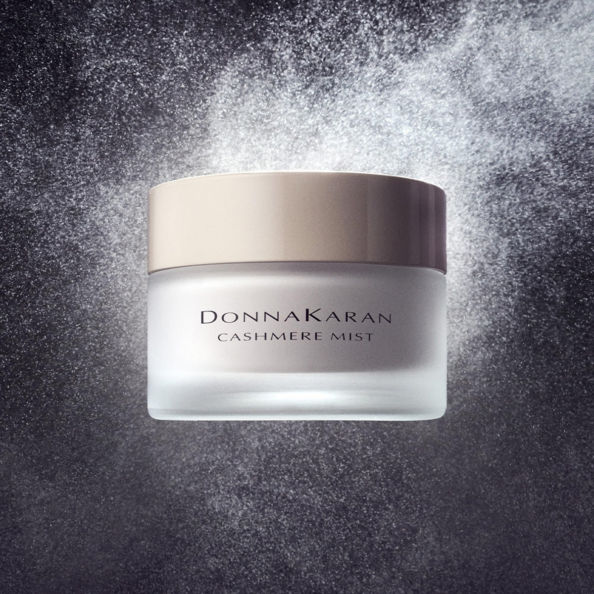 Donna Karan Cashmere Mist bottle cap closeup emphasizes premium packaging and daily use
