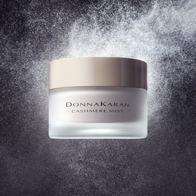 Donna Karan Cashmere Mist bottle cap closeup emphasizes premium packaging and daily use
