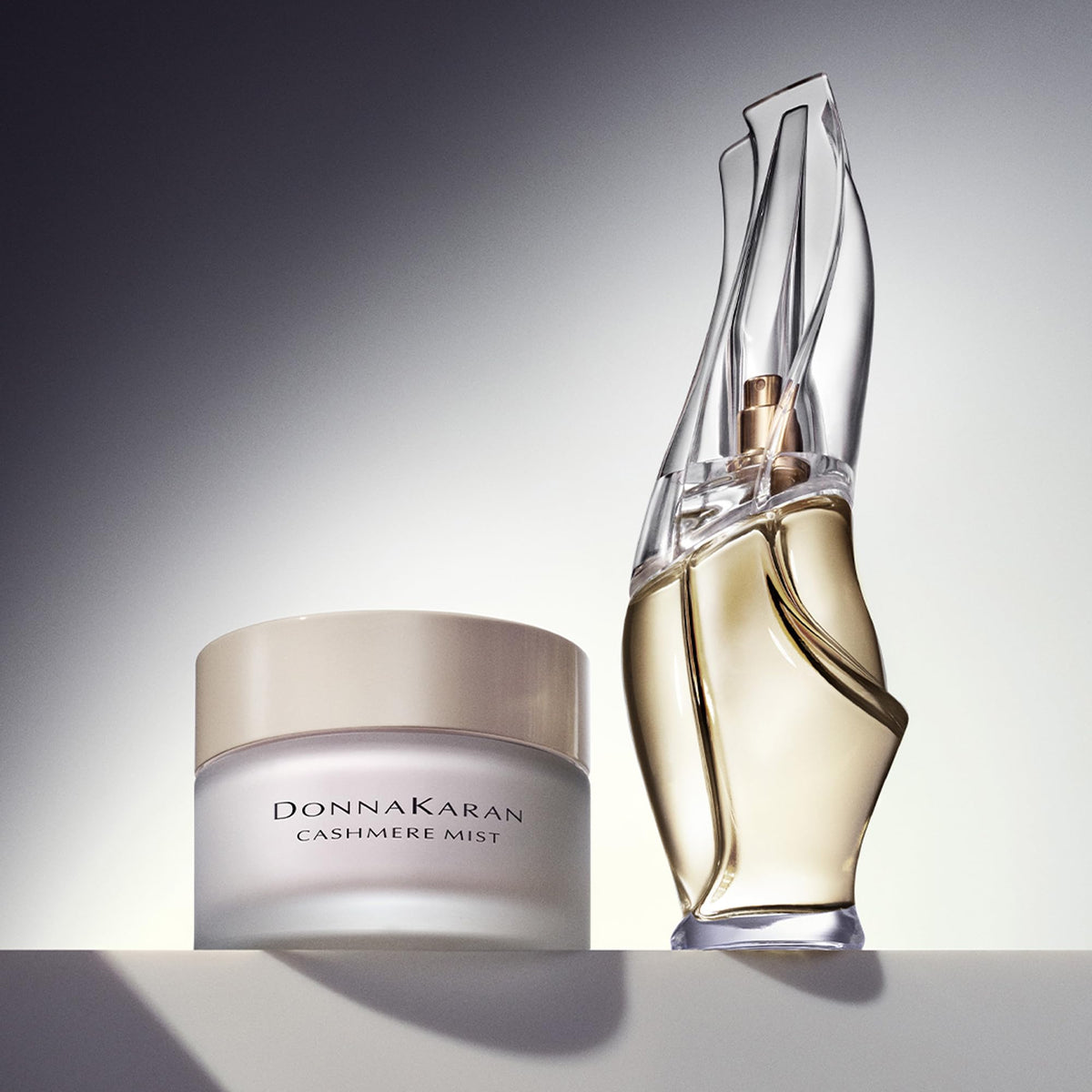 Donna Karan Cashmere Mist fragrance note montage hints at amber floral aroma