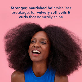 Dove Crown Hydration Restore Conditioner application scene highlights detangling ease for curls.
