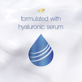 Dove conditioner close-up with hyaluronic serum for smoother hair.