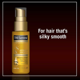 Dove Keratin Smooth Shine Oil on hair ready for styling