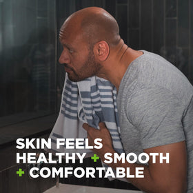 Hands and face being washed with Dove Men+Care Extra Fresh bar in shower.
