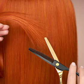 Dozmux packaged hairdressing tools with leather bag for storage.