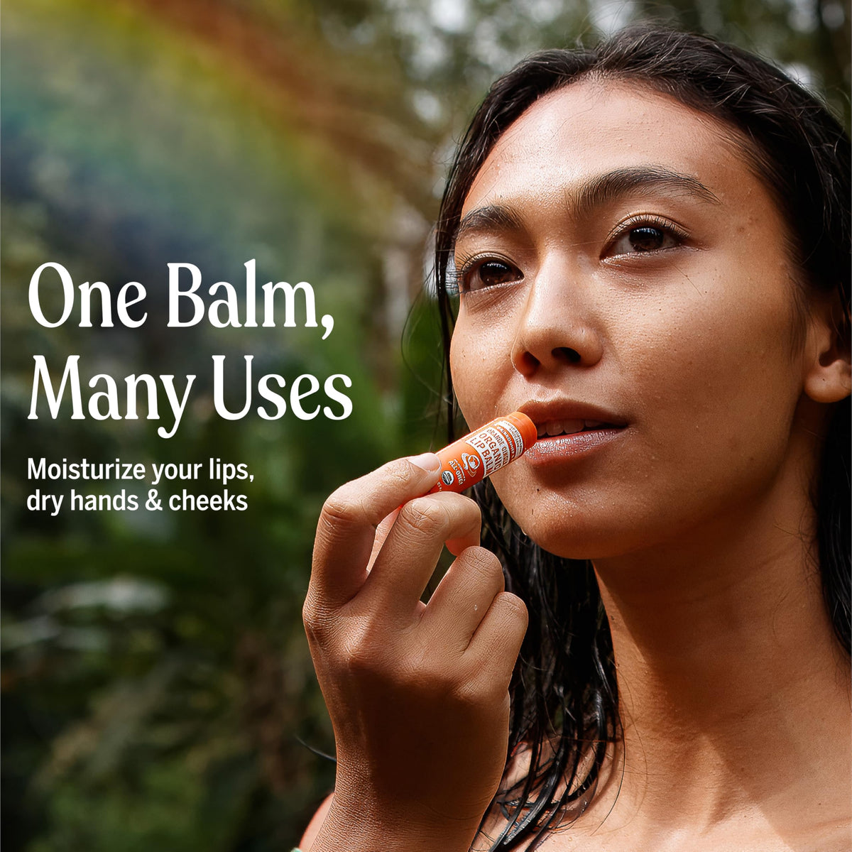 Applying Dr. Bronner's lip balm on dry lips in cold weather.