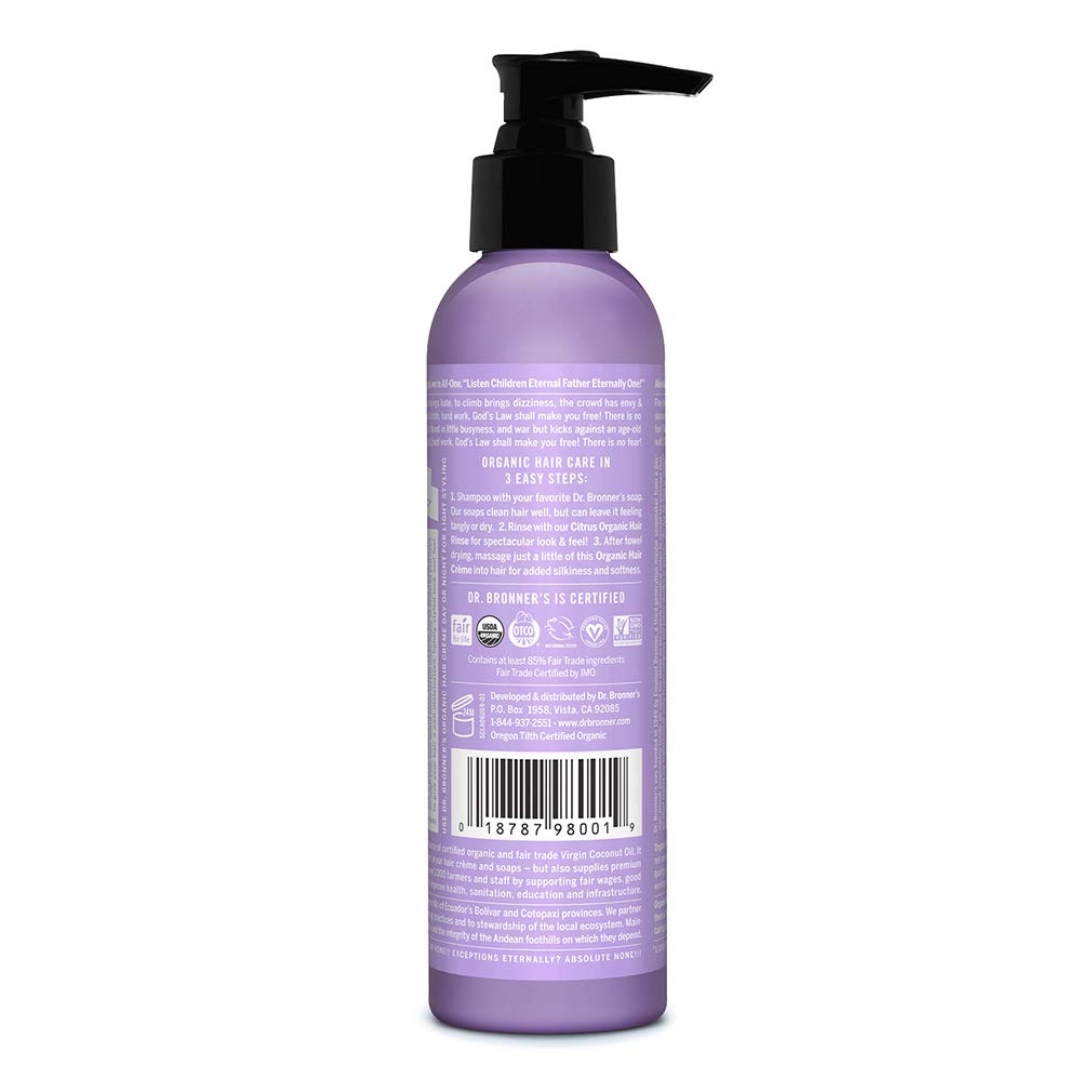 Hands applying Dr. Bronner's Organic Hair Creme for easy manageability.
