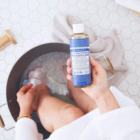 Dr. Bronner's Almond Pure-Castile bottle for versatile cleaning and personal care.