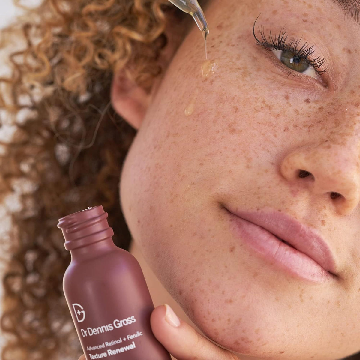 Dr Dennis Gross Advanced Retinol + Ferulic Serum dropper closeup for precise dosing and texture refinement.