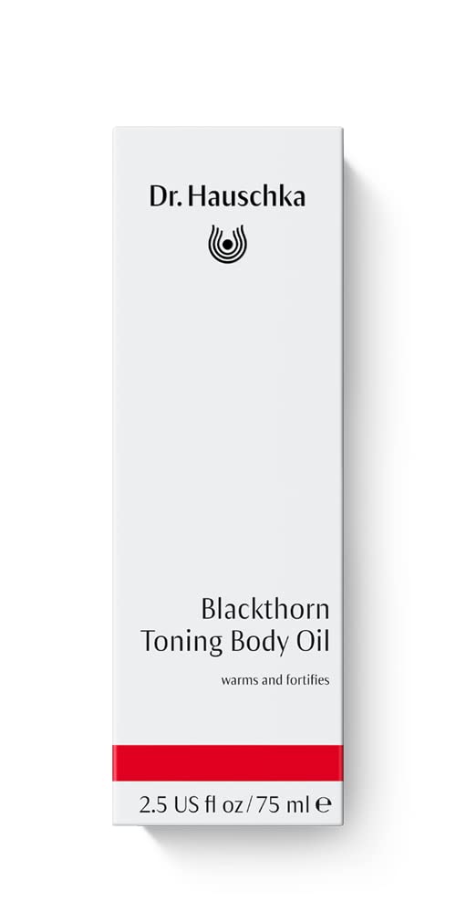 Texture close-up of Dr. Hauschka Blackthorn Toning Body Oil highlights silky oil for skin nourishment.