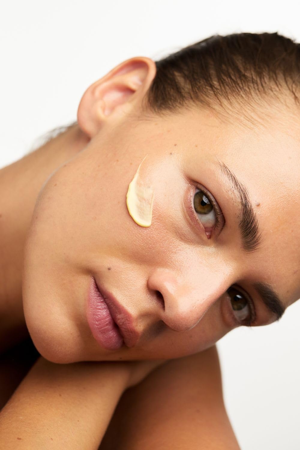Quince Day Cream on neck and decollete for smooth, even tone.