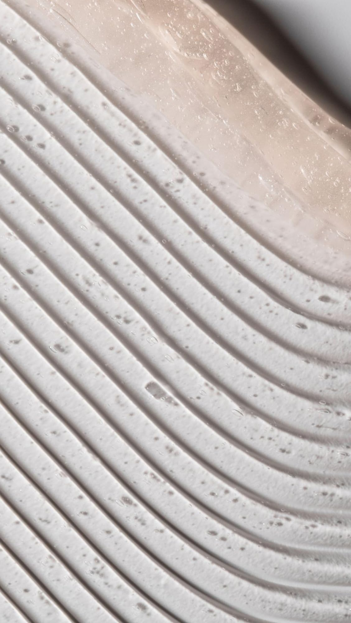 Dr. Loretta eye-area application close-up shows gentle patting technique for contour tightening.