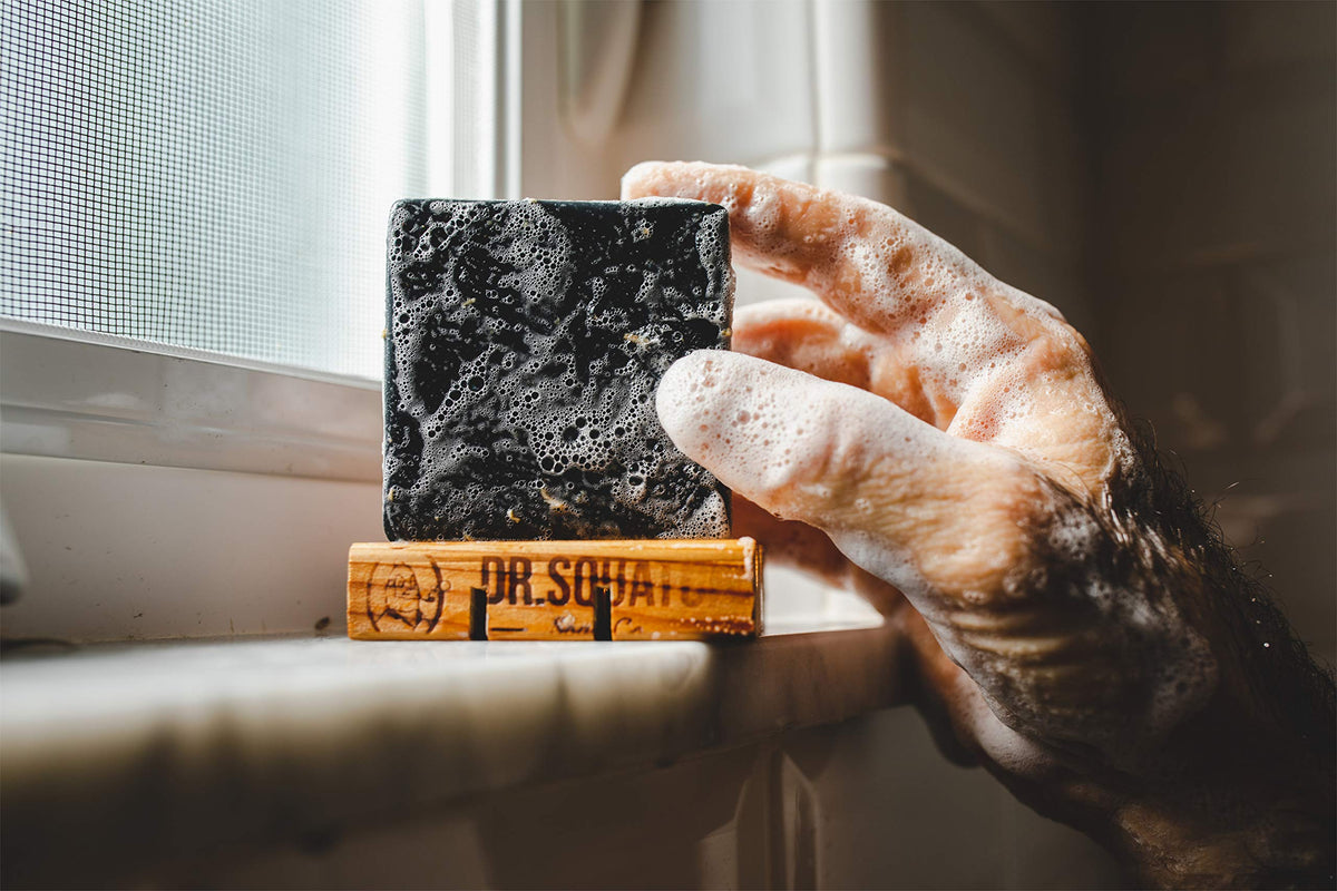 Dr. Squatch Pine Tar Soap exfoliating scrub texture highlights smoother skin during routines.