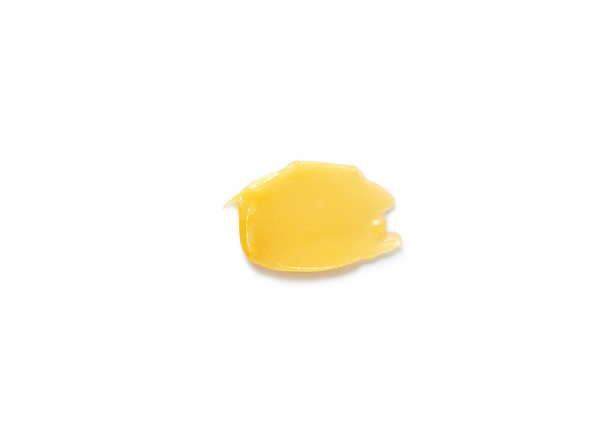 Dr. Hauschka lip balm being applied to lips for soothing care.