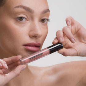 DRMTLGY Lip Silk SPF 40 No White Cast preserves a natural look under sun.