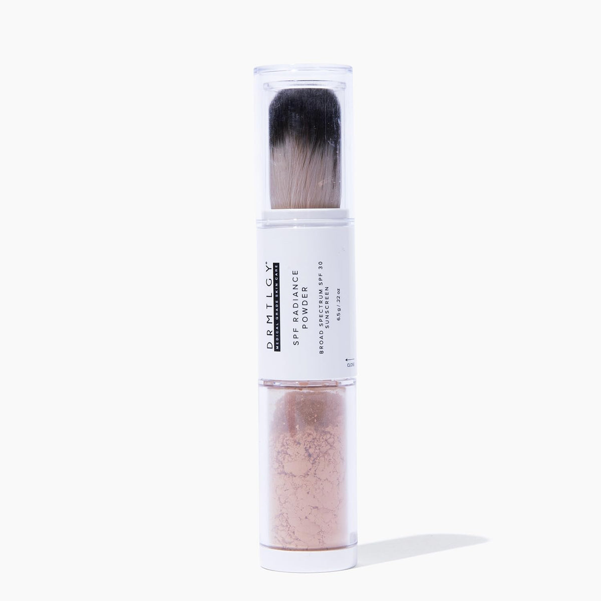 DRMTLGY SPF Radiance Powder bottle with self-dispensing applicator for on-the-go touch-ups.