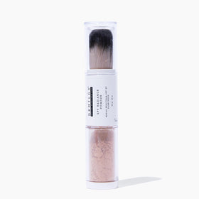 DRMTLGY SPF Radiance Powder bottle with self-dispensing applicator for on-the-go touch-ups.