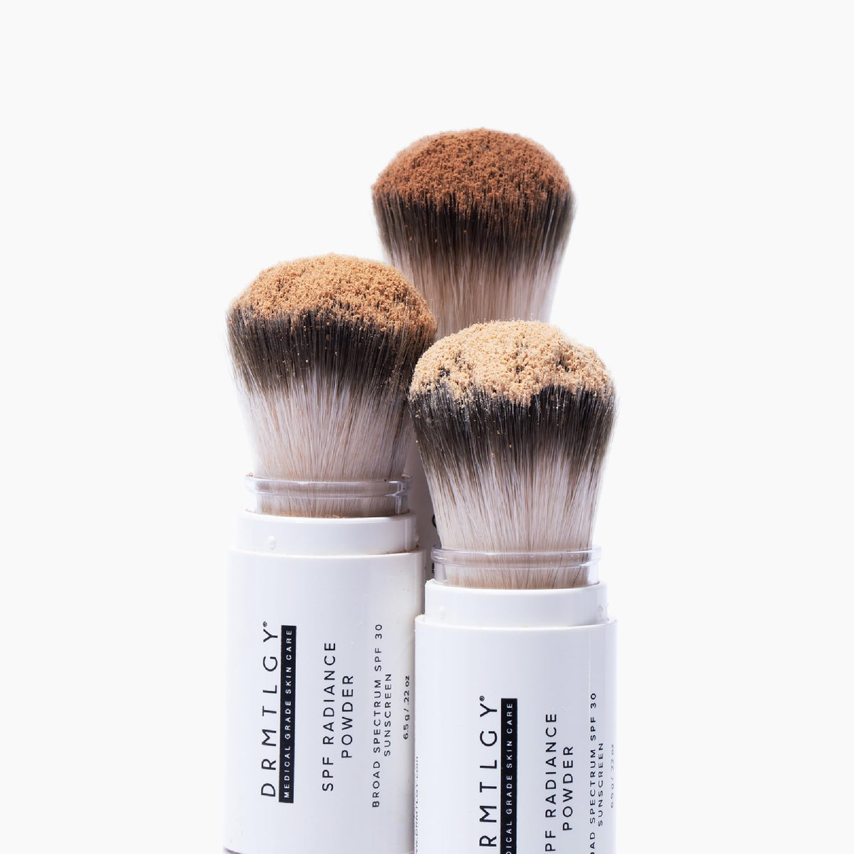 DRMTLGY SPF Radiance Powder packaging showing compact design and shade blend.