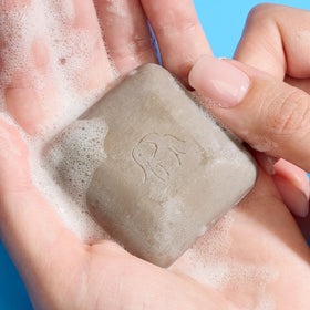 Drunk Elephant Juju Bar cream-lather reveals a creamy cleanse that leaves skin feeling smooth.