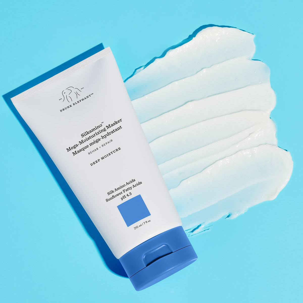 Applying Drunk Elephant Silkamino Masker to hair for smoothing and hydration