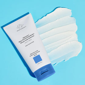 Applying Drunk Elephant Silkamino Masker to hair for smoothing and hydration