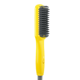 Drybar Baby Brush Crush Mini in a bag showing travel-friendly styling potential.